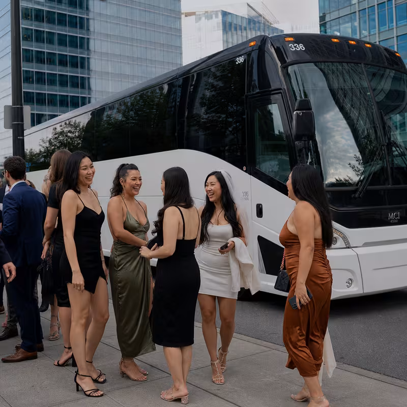 Passengers loading luggage while boarding an Bellevue group shuttle