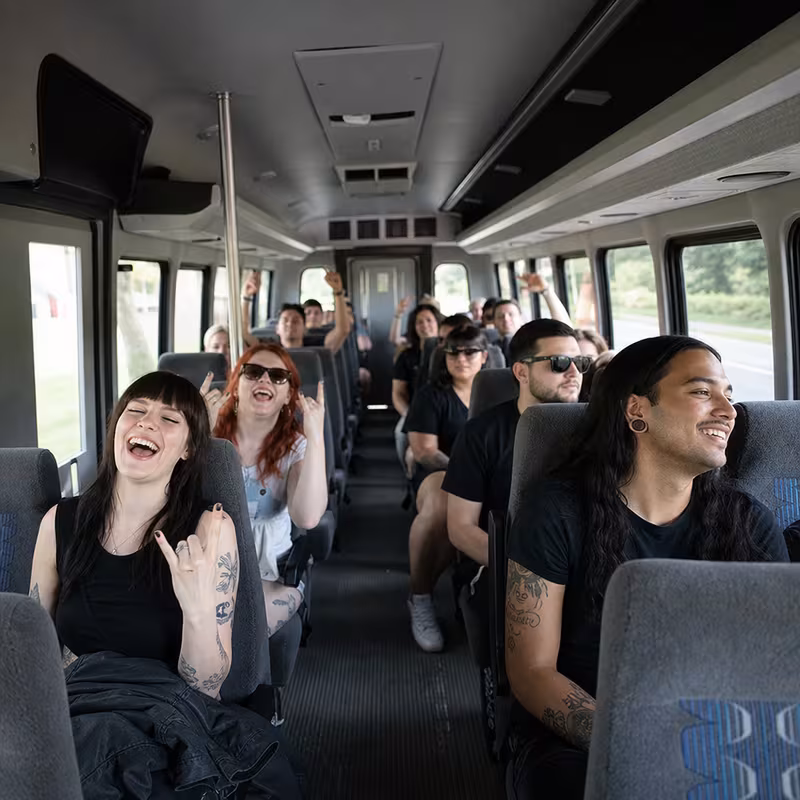 Party bus interior with wraparound leather seating and LED lighting in Bellevue