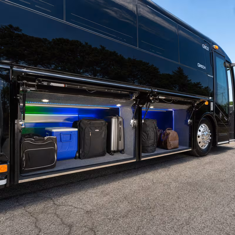 Party bus interior with wraparound leather seating and LED lighting in Bellevue