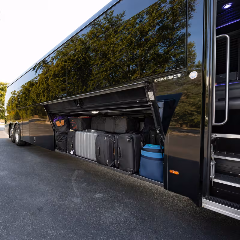 Party bus interior with wraparound leather seating and LED lighting in Bellevue