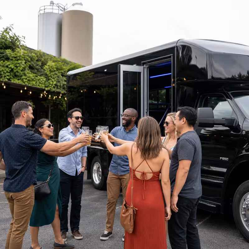 Passengers loading luggage while boarding an Bellevue group shuttle
